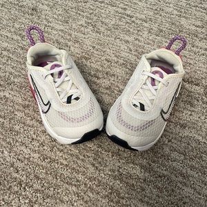 White, pink, and purple Nikes. Size 4.5z. Worn a few times still looks brand new